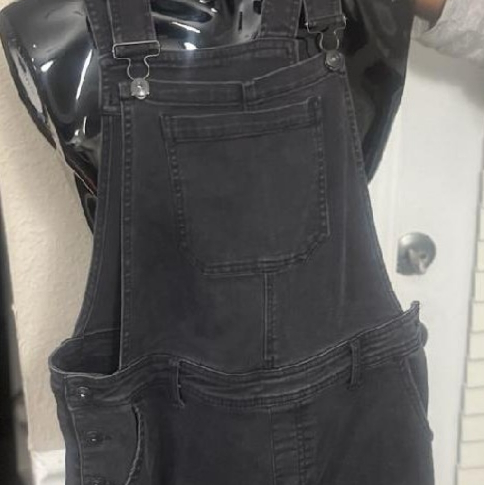 Black overalls with slit in knee